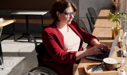 freelancer typing on her laptop