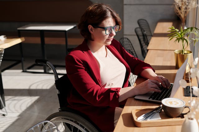 freelancer typing on her laptop