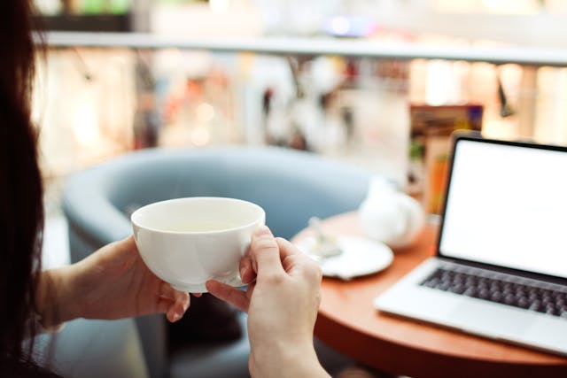 freelancer holding a cup of tea