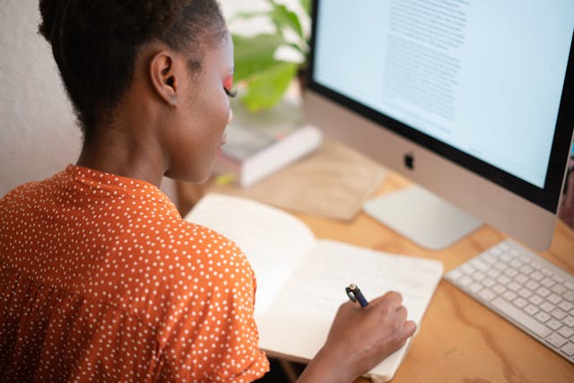 freelancer writing on her desk