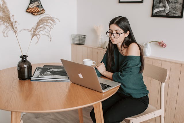 freelancer looking at her laptop