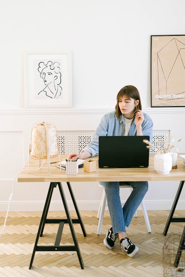 freelancer sitting on a chair with laptop in front of her